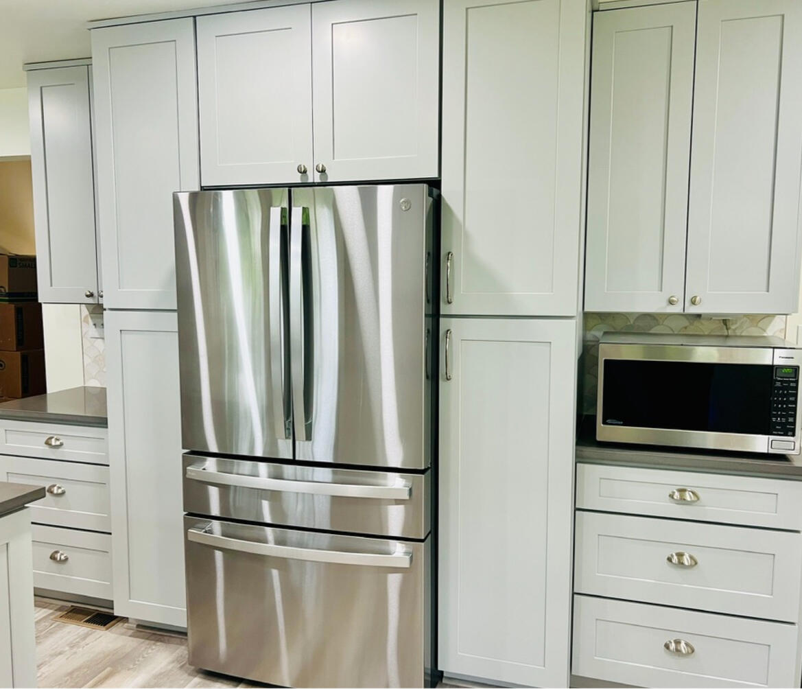 Floor-to-ceiling pantry storage maximizing organization without sacrificing style.